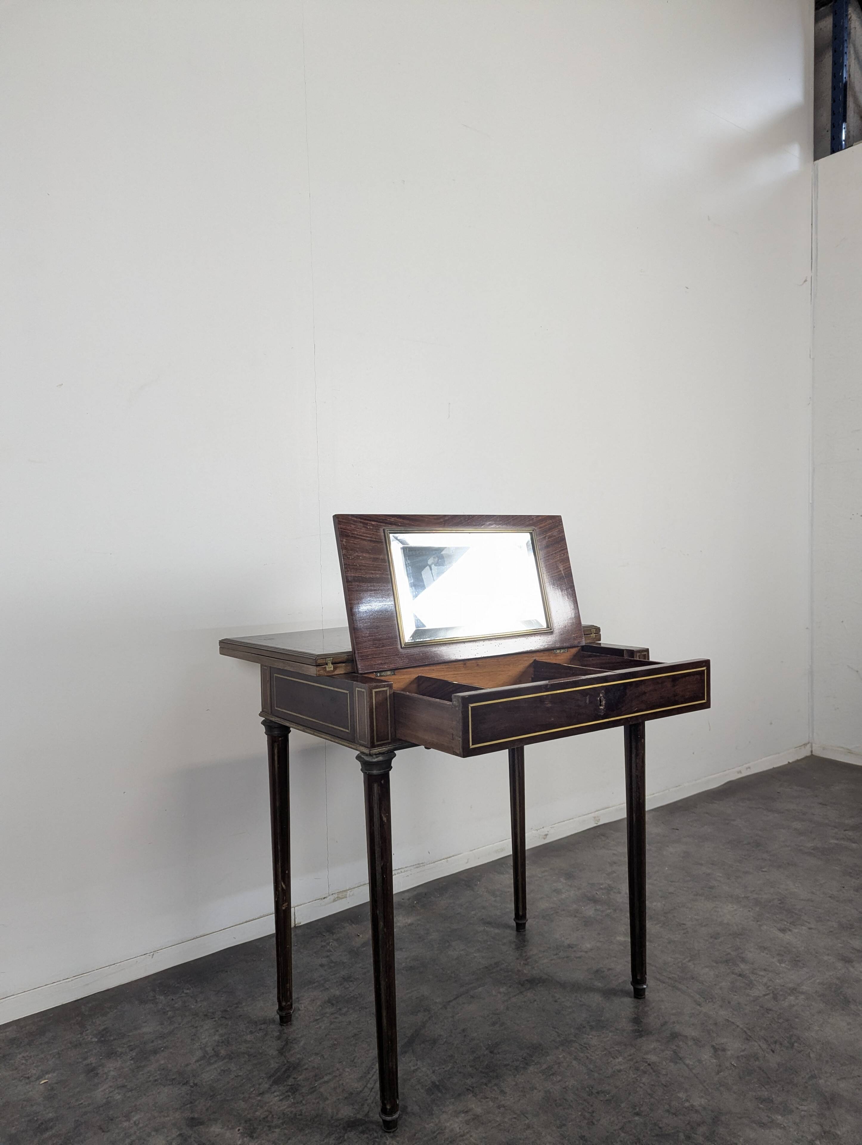 Louis XVI style mahogany game table, dressing table, and secretary.