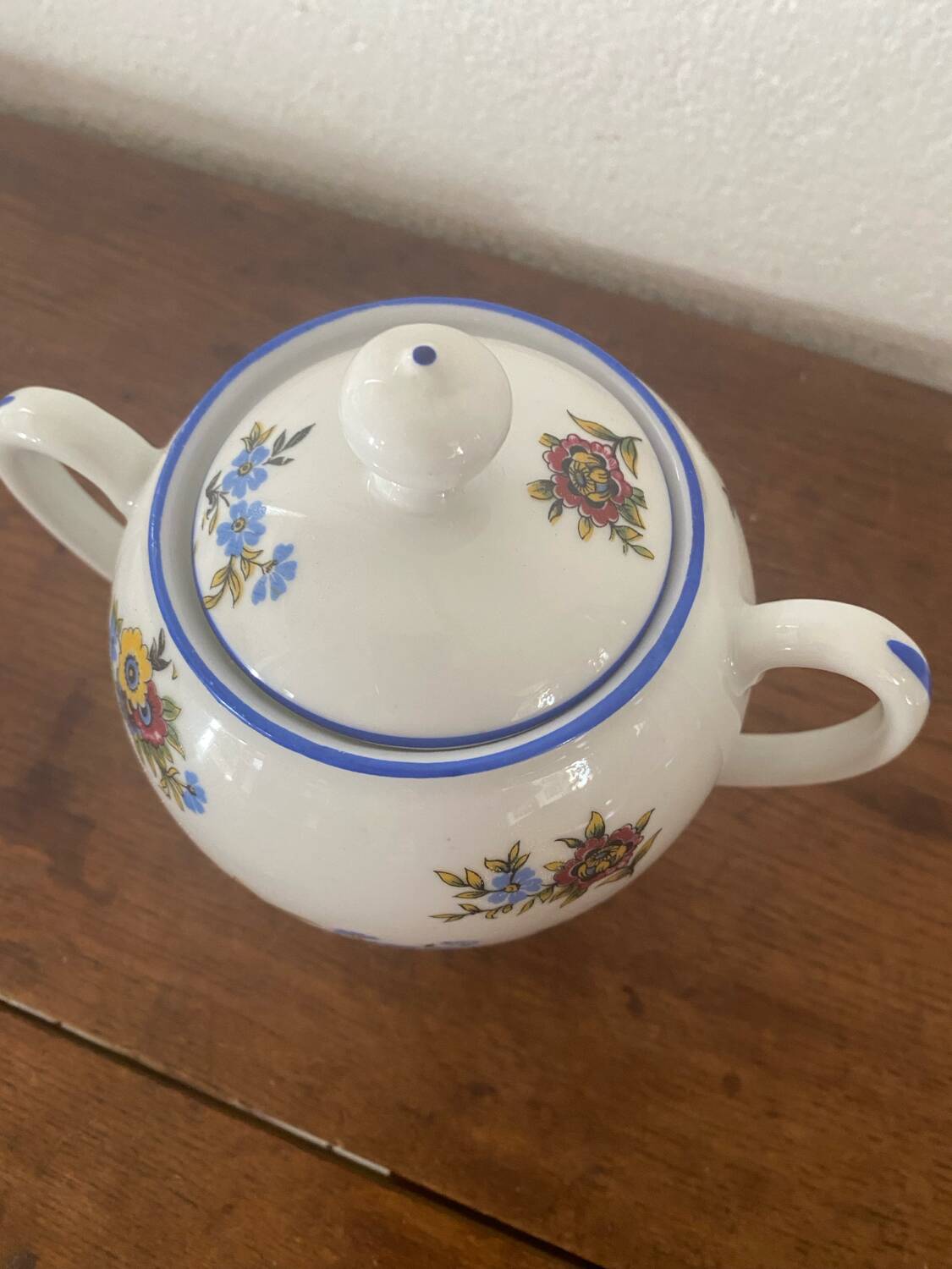 Large sugar bowl with floral porcelain.