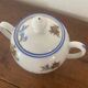 Large sugar bowl with floral porcelain.