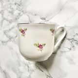 Teacup on its saucer and porcelain cake plate