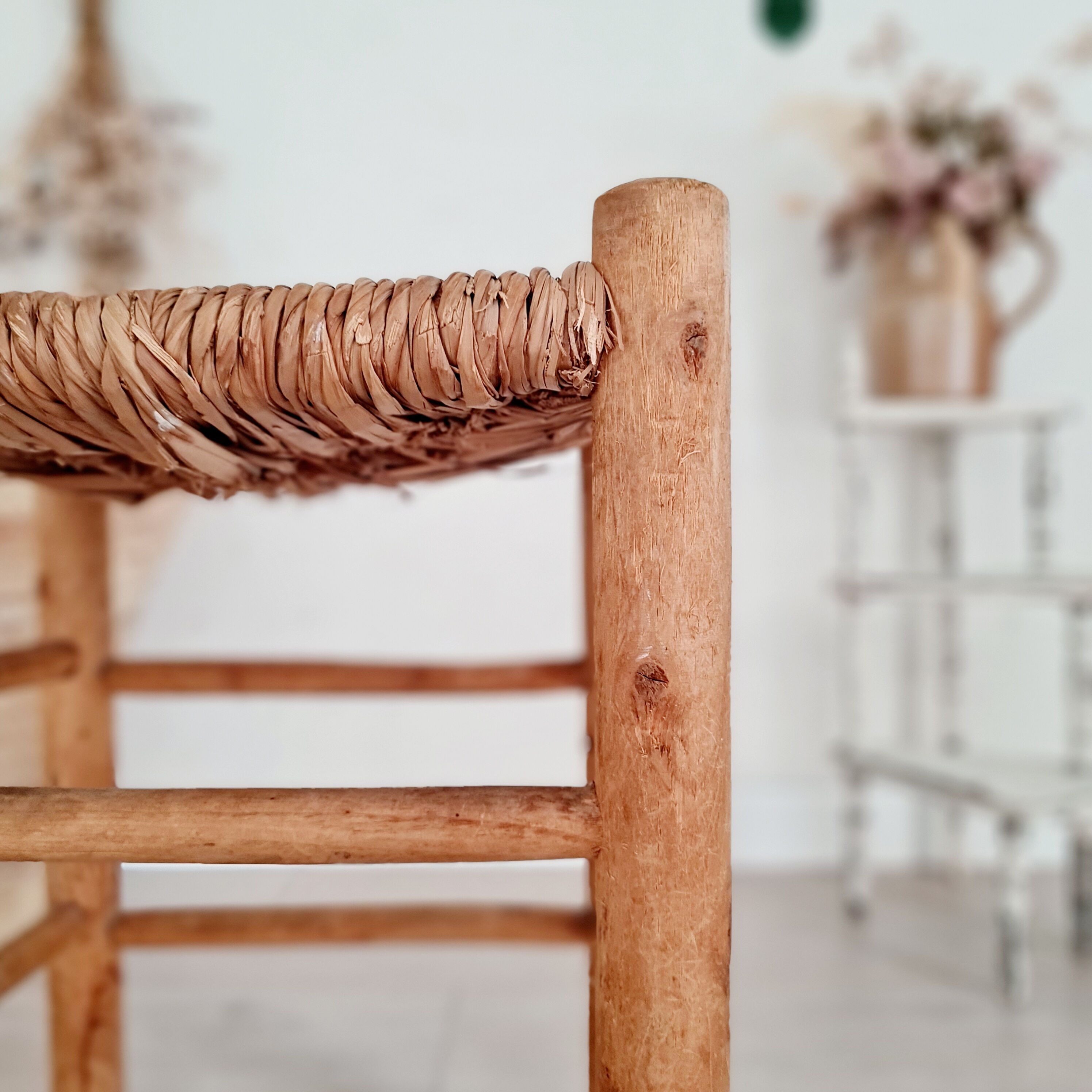 Old stool in wood and straw brutalist look