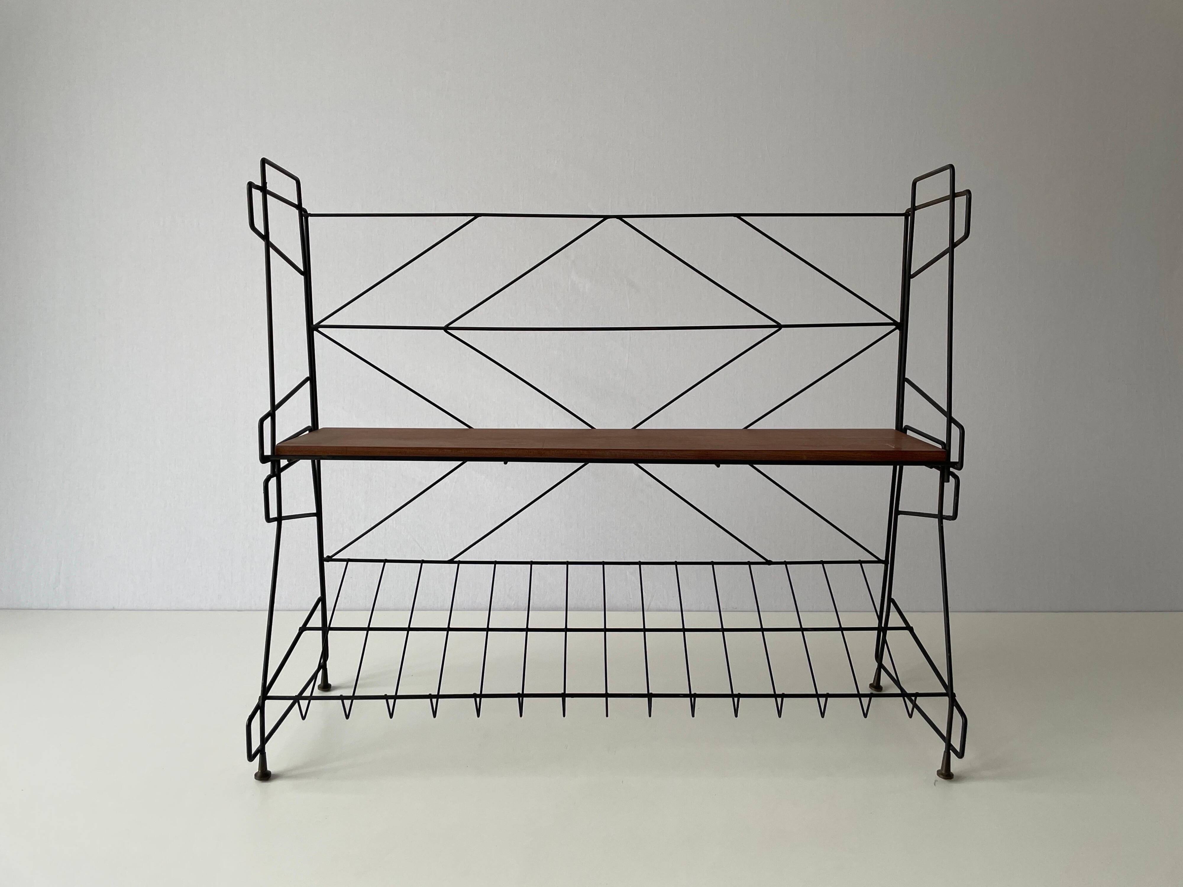 Free-standing shelf with a metal structure and 3 shelves, 1960s, Italy.