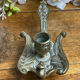 Hand candlestick, peacock shape, in bronze
