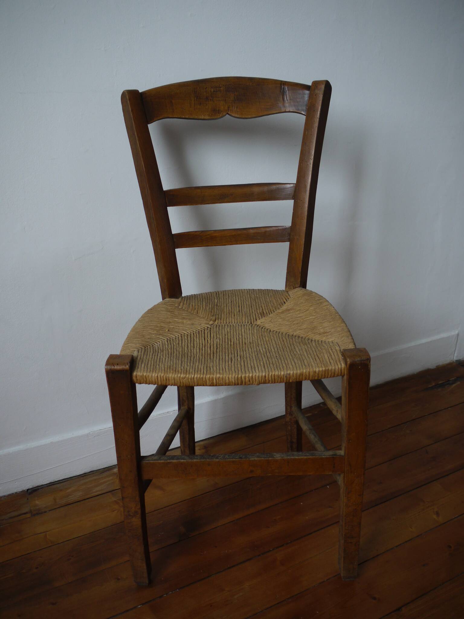 Wooden chair with straw seat