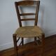 Wooden chair with straw seat
