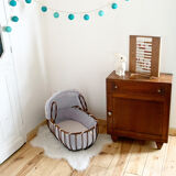 Vintage rattan cradle and its wheeled support