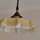 Electrified suspension with a frosted opaque glass disc shade.