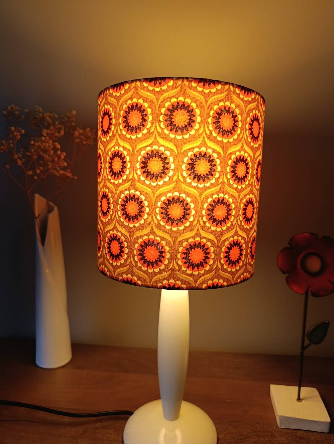 vintage white wood lamp with a seventies graphic flower shade