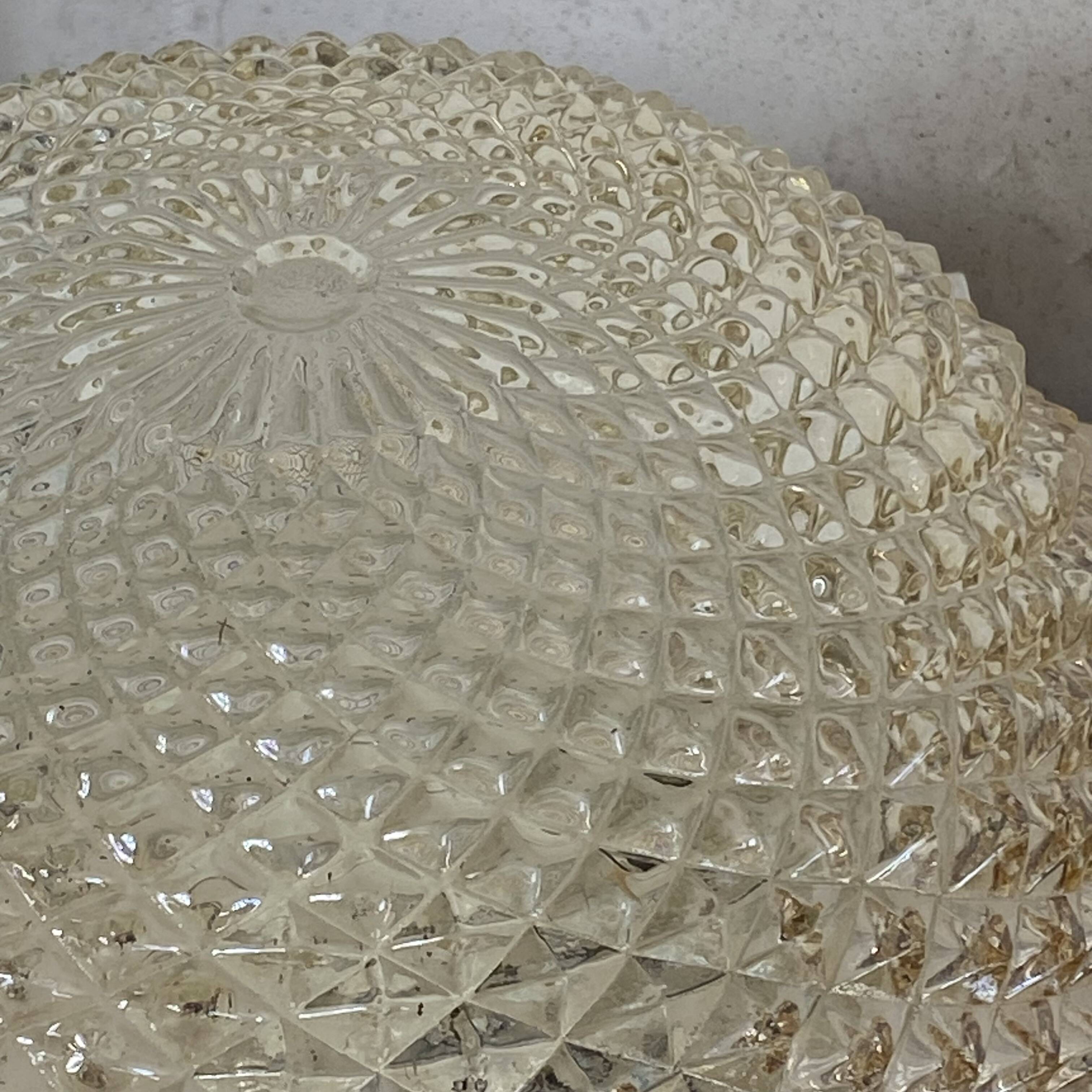Amber glass wall light or ceiling light with a diamond tip.