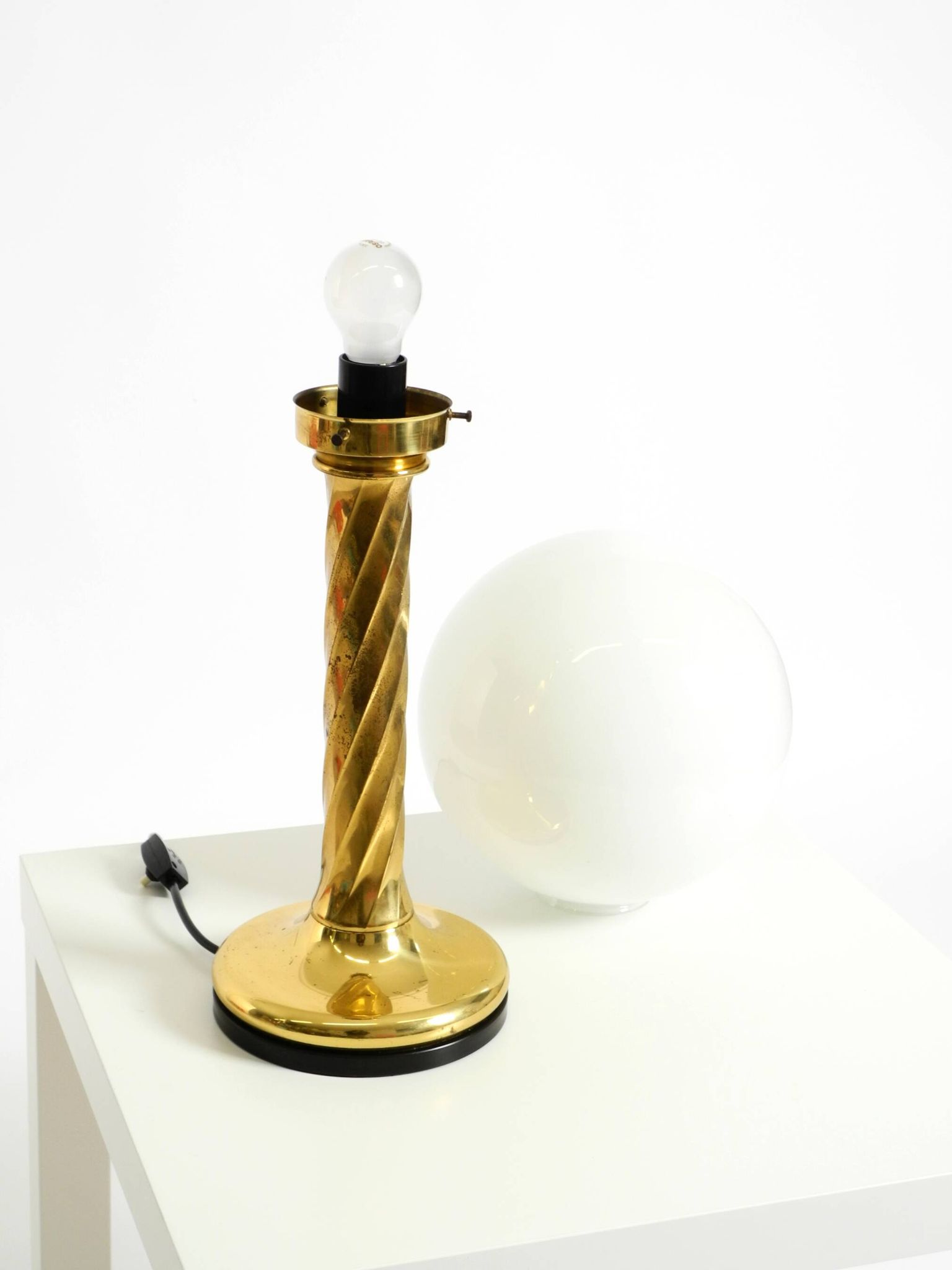 Large 1960s brass column-style table lamp with frosted glass globe