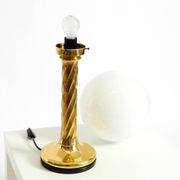 Large 1960s brass column-style table lamp with frosted glass globe