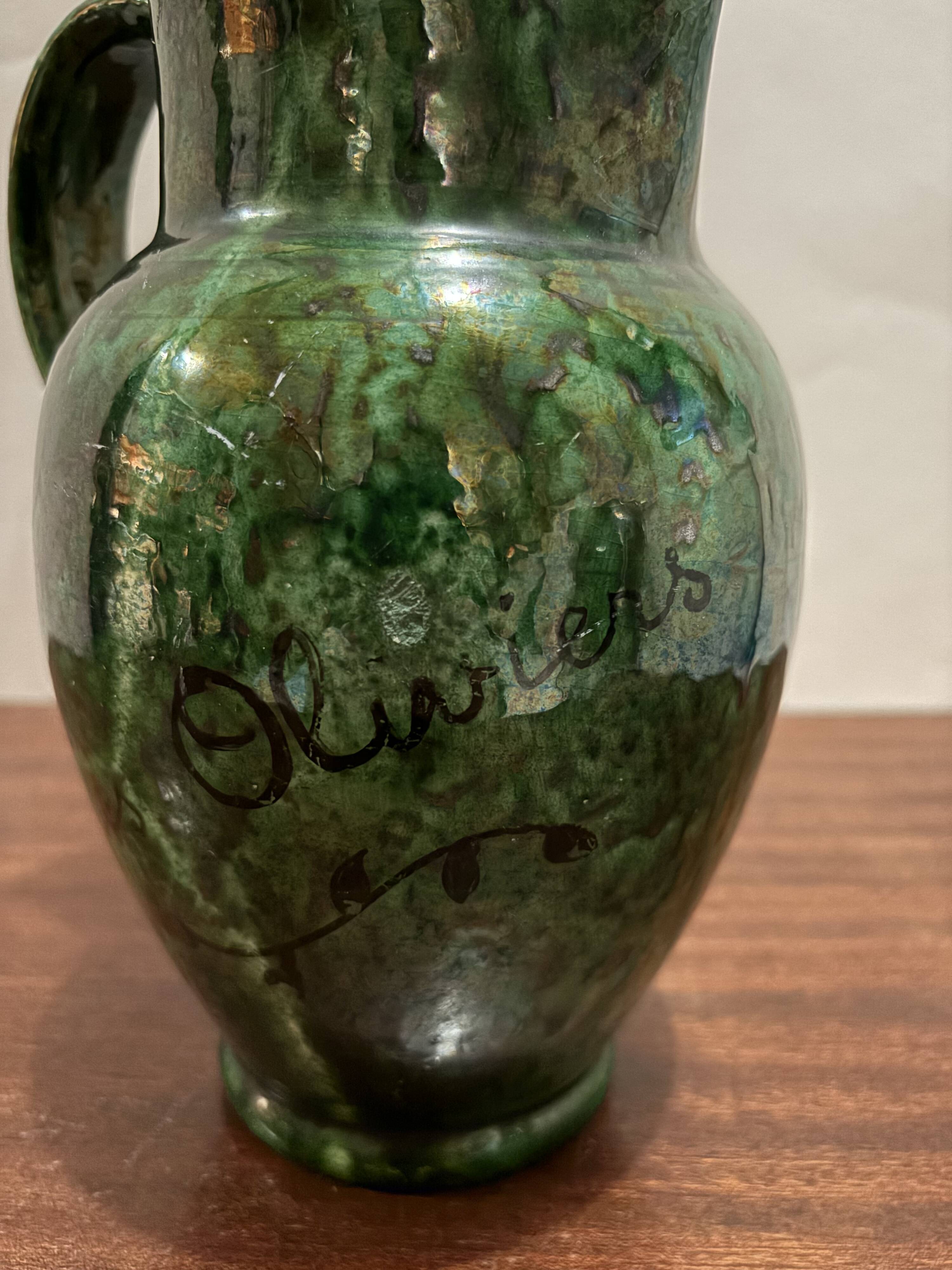 Green glazed ceramic pitcher