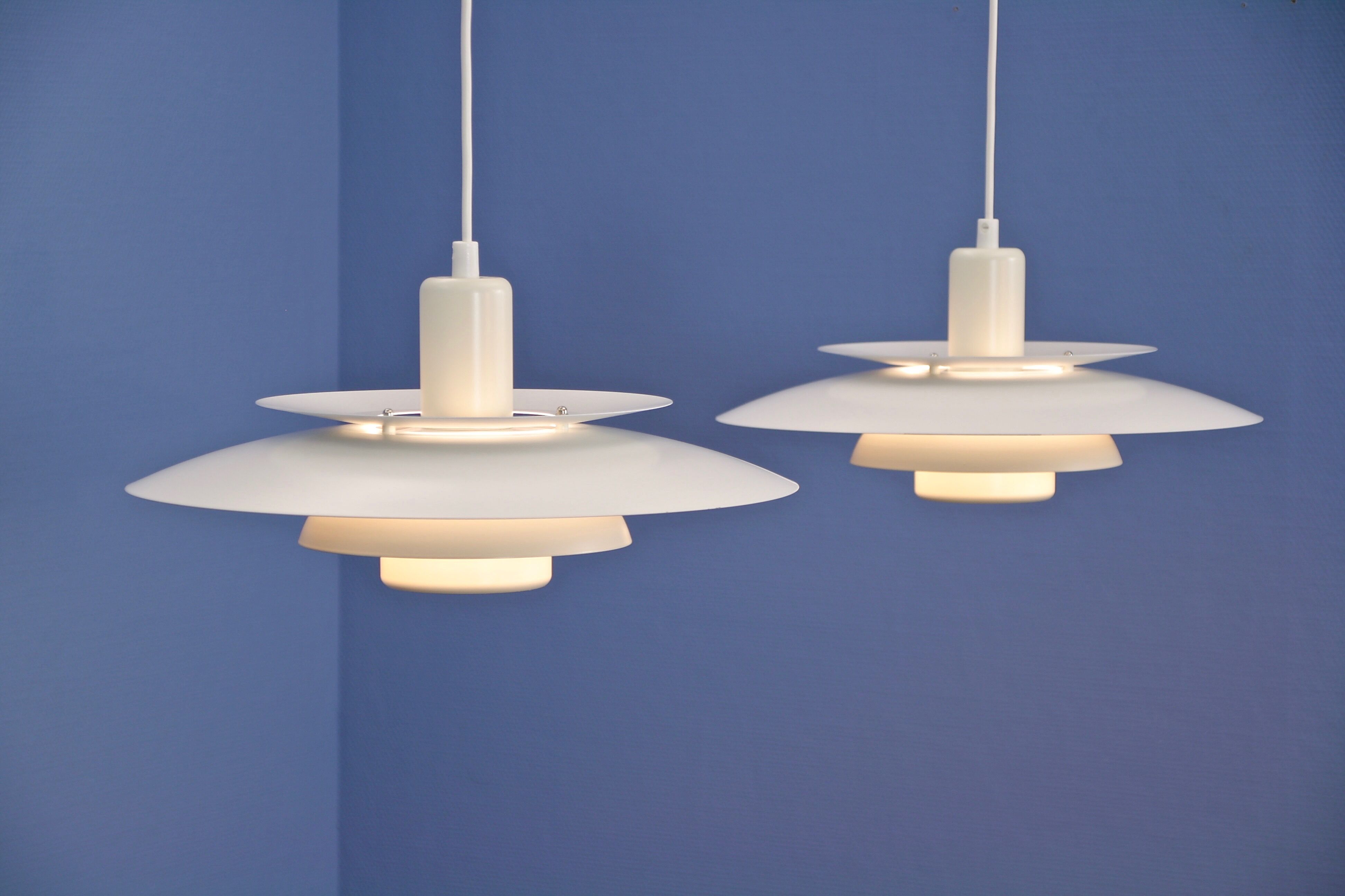 Set of 2 danish hanging lamps in white and off white by Lyskaer, 1970s