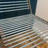 2 metal chairs with bungee cords