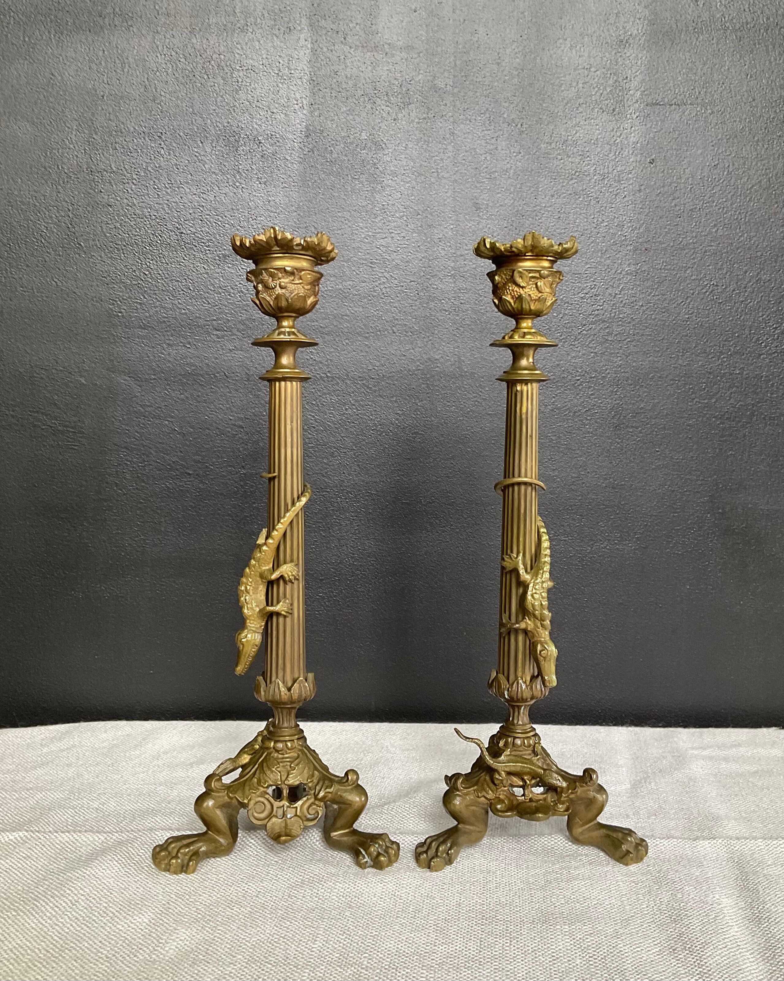 Pair of 19th-century gilded bronze candlesticks in Empire style.