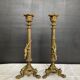 Pair of 19th-century gilded bronze candlesticks in Empire style.