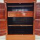 Antique red cabinet with brass details