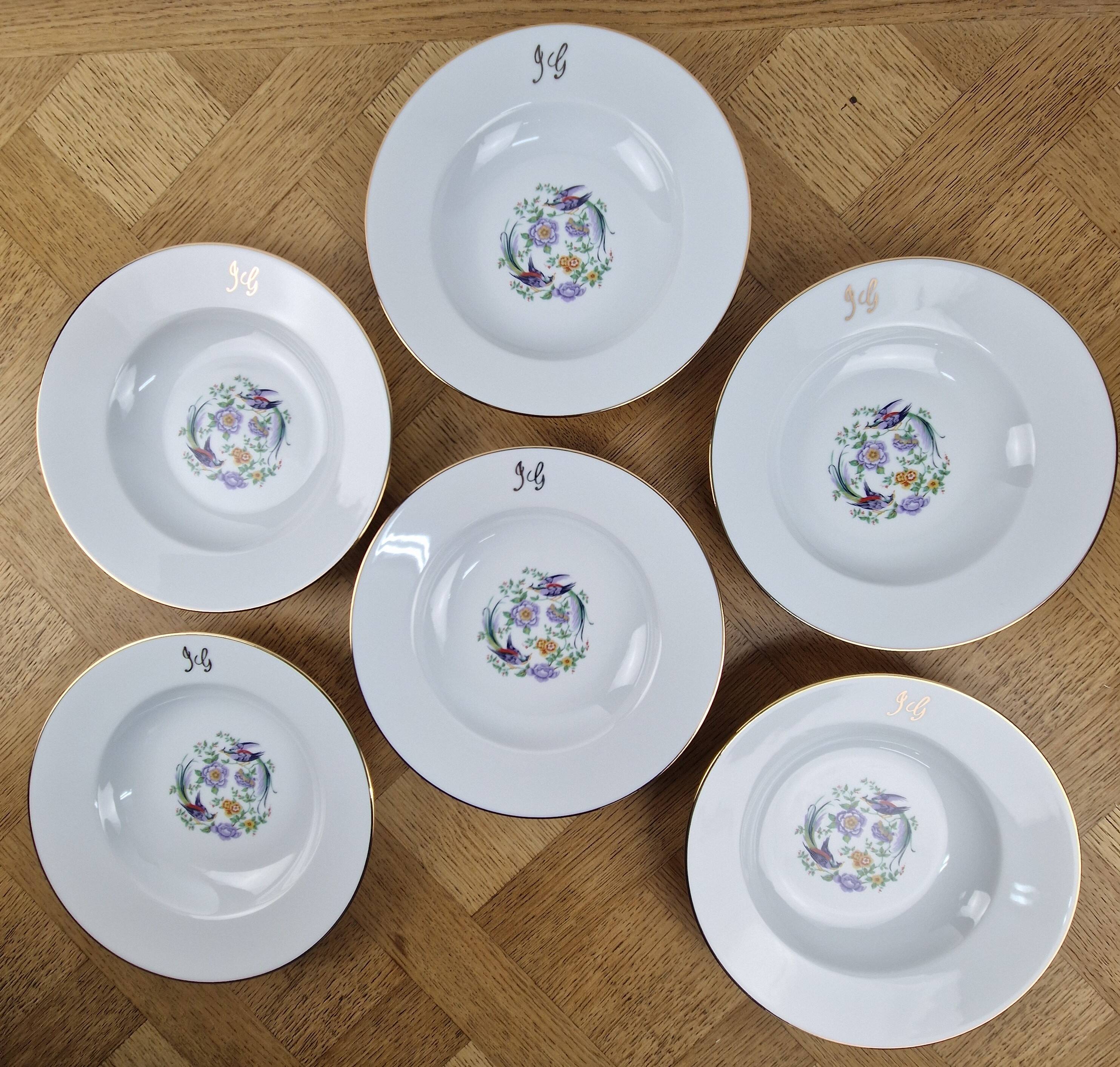 6 deep plates made of Limoges porcelain with a paradise bird design.