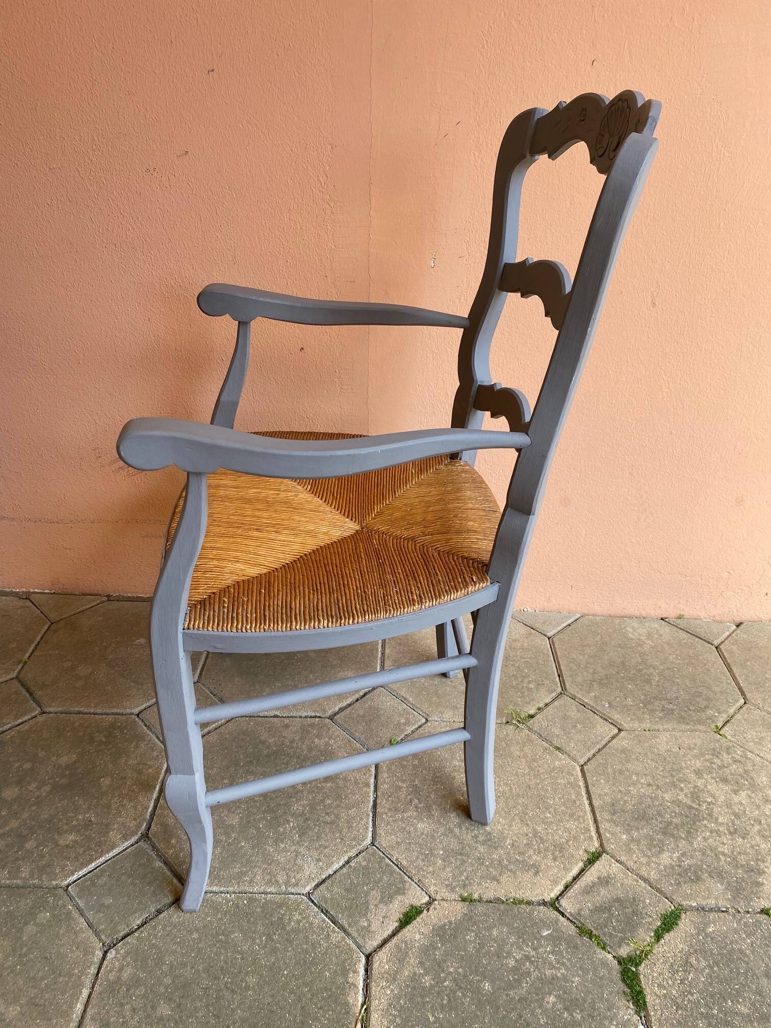 Provencal style straw armchair with gray blue patina armrests