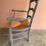 Provencal style straw armchair with gray blue patina armrests