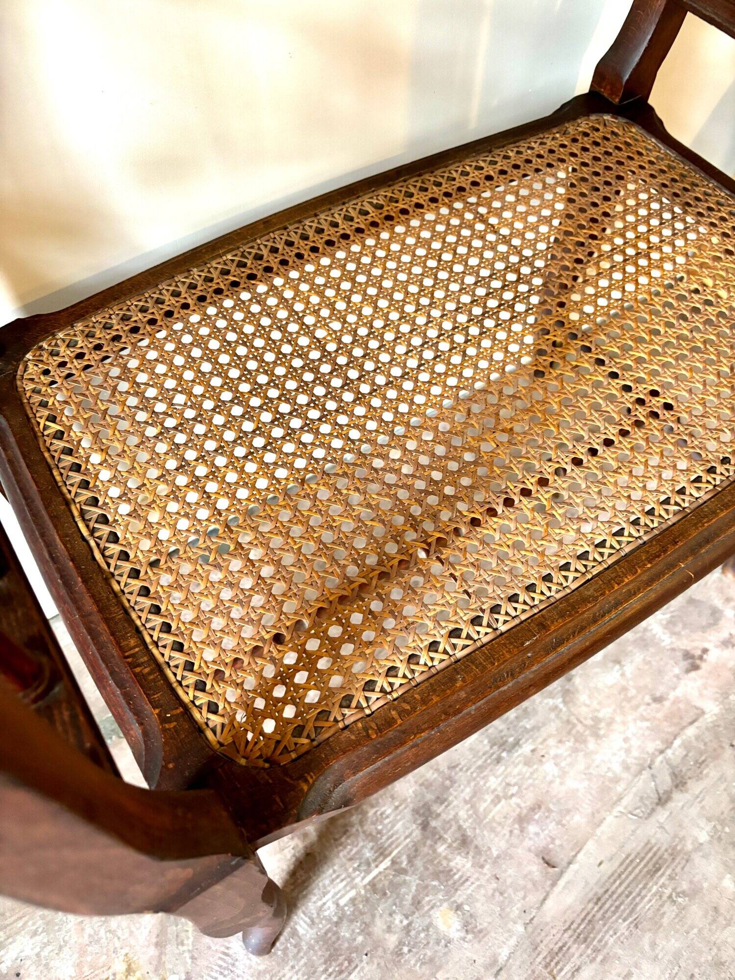 Dark wood and cane bench