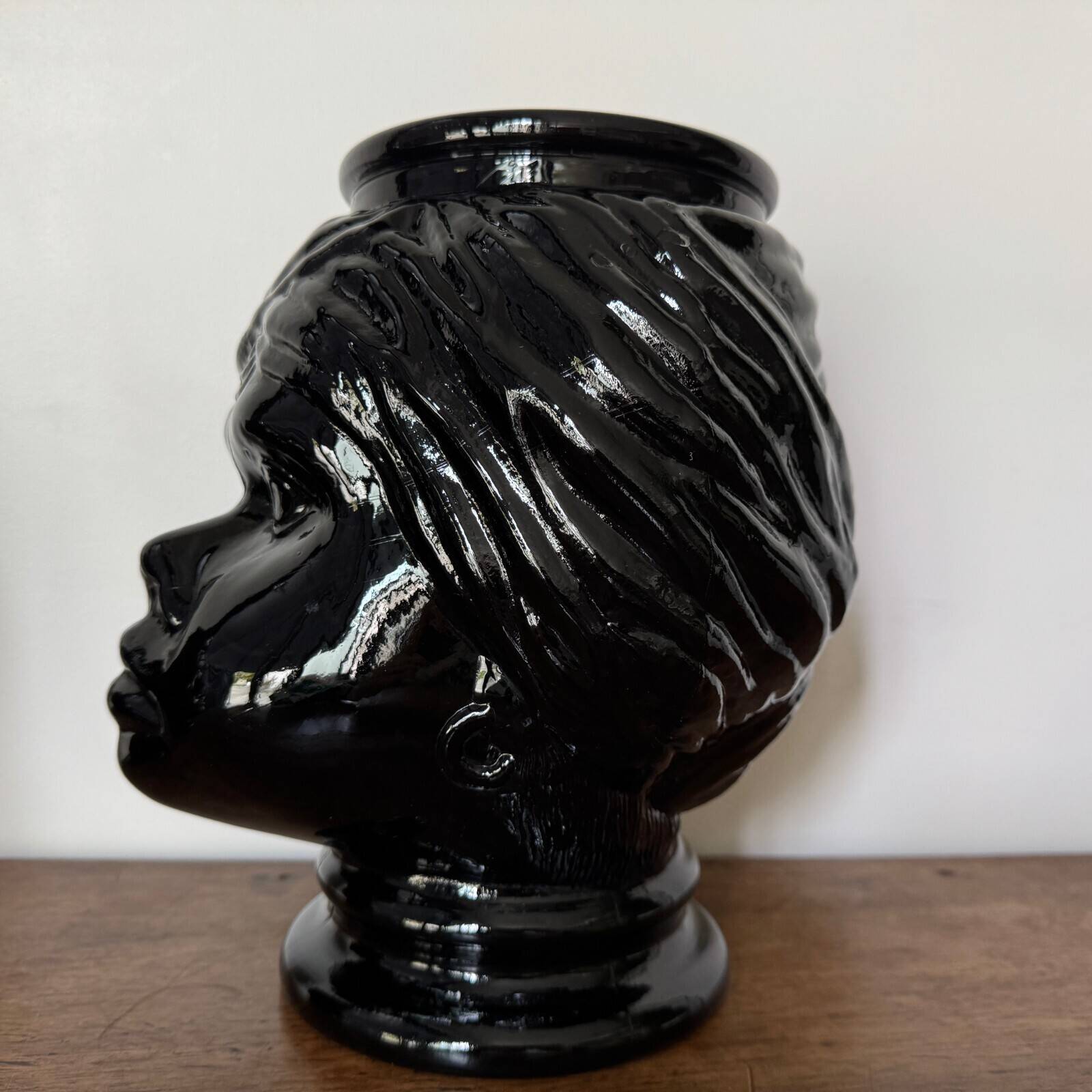 2 glass heads representing Moors