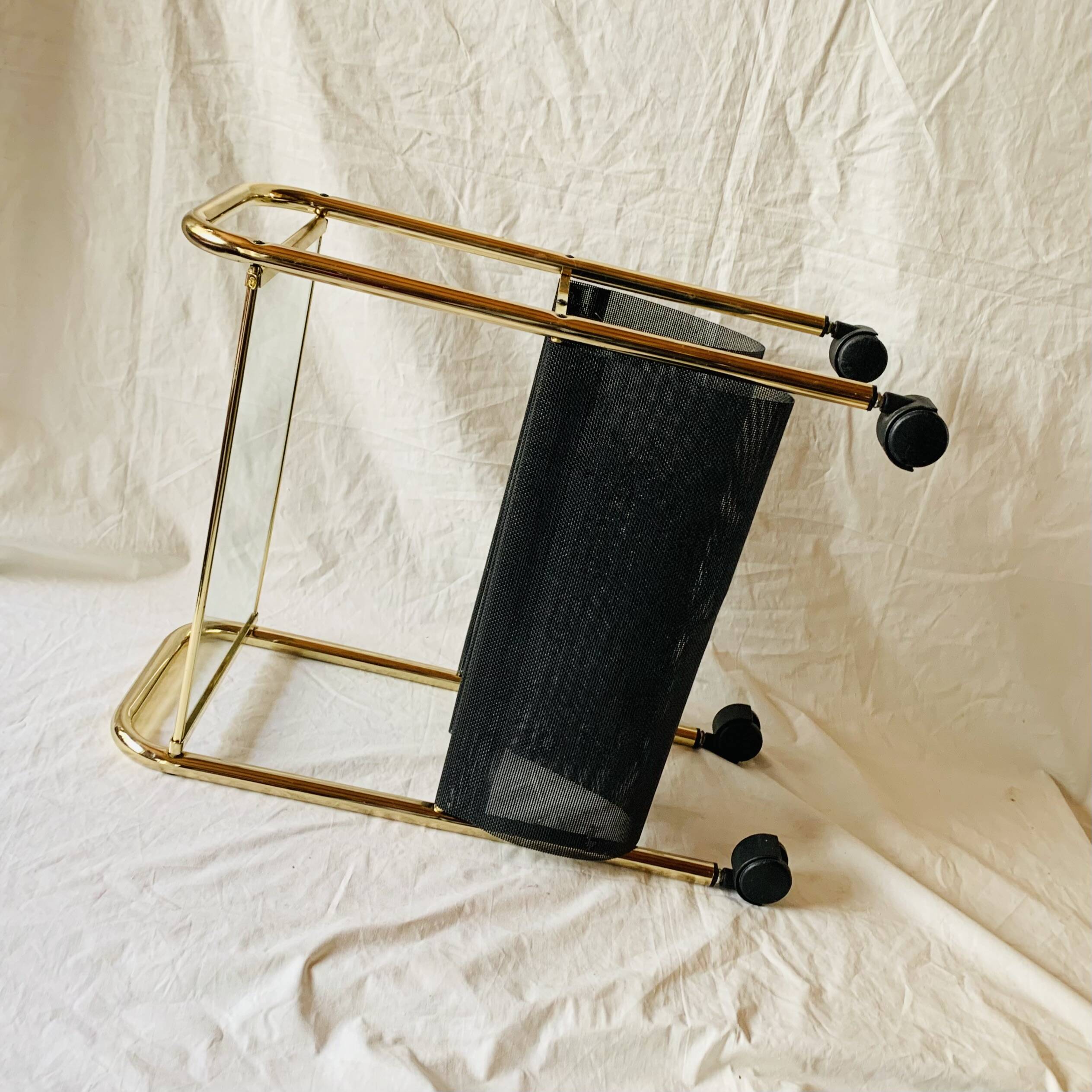 Magazine rack, saddle on vintage wheels