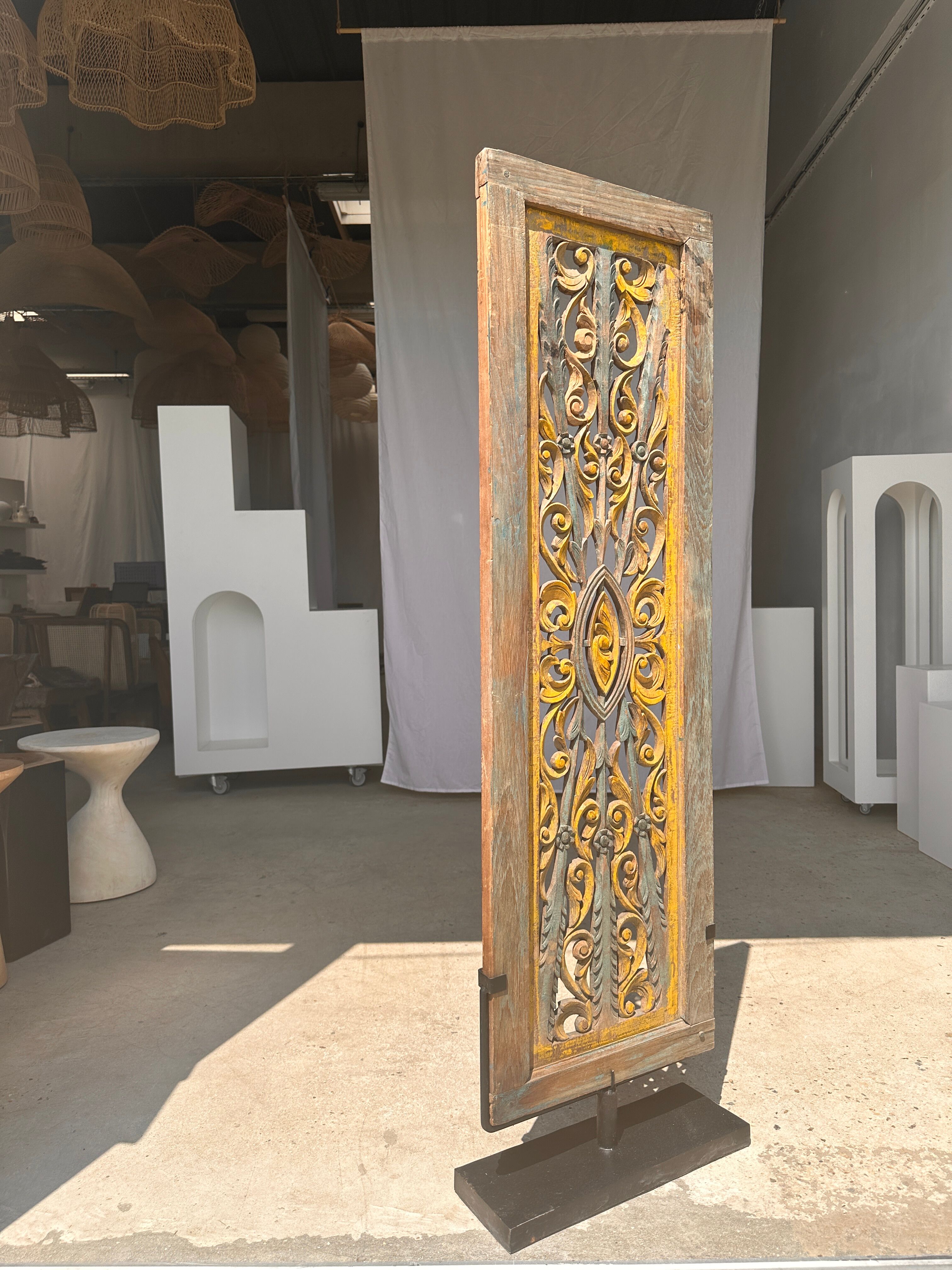 Rectangular Indonesian construction element with blue and yellow plant in carved wood