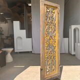 Rectangular Indonesian construction element with blue and yellow plant in carved wood