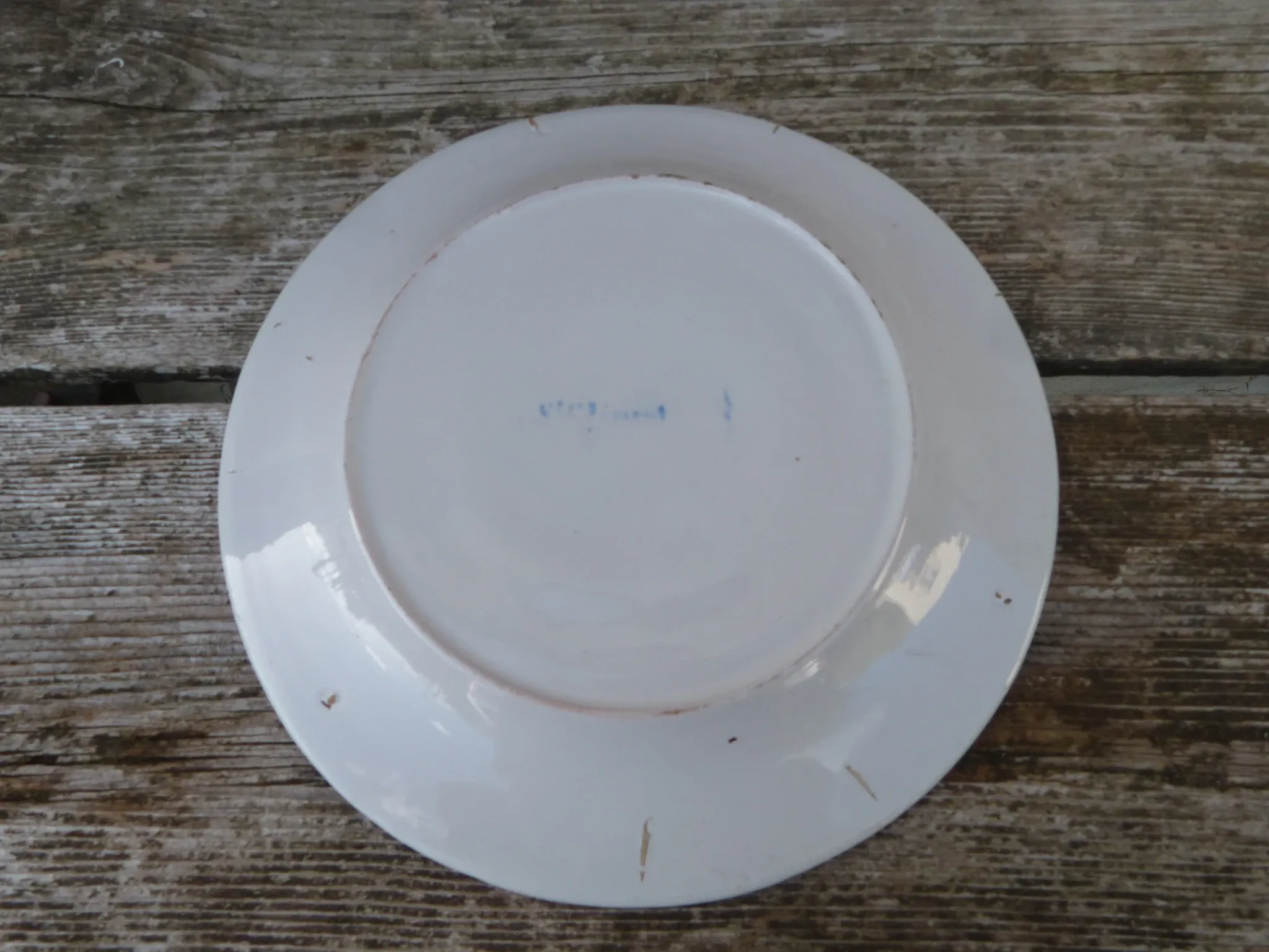 Old St Clément earthenware plate, flat plate with flower patterns.