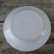 Old St Clément earthenware plate, flat plate with flower patterns.