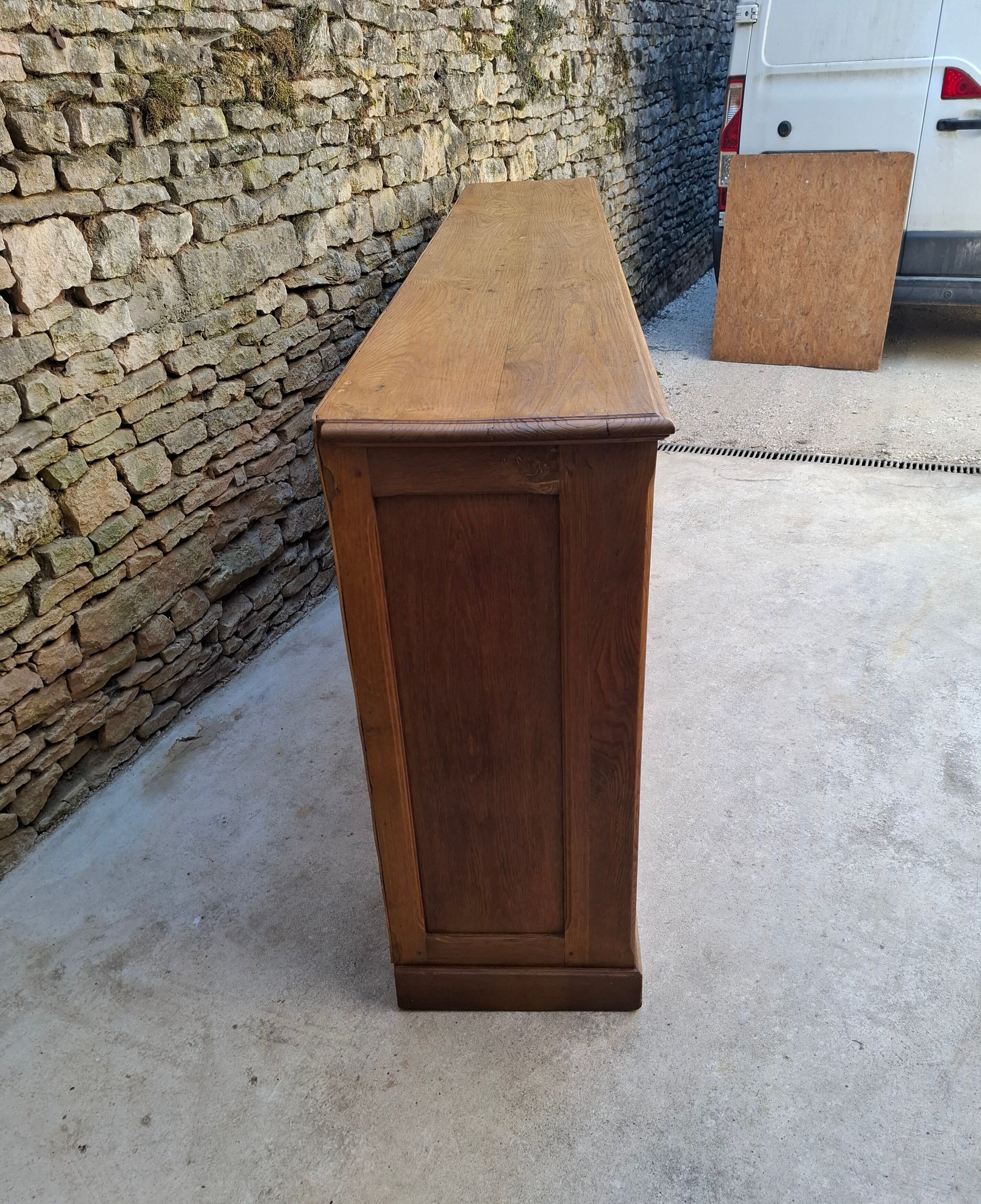 Oak workshop furniture with sliding doors.