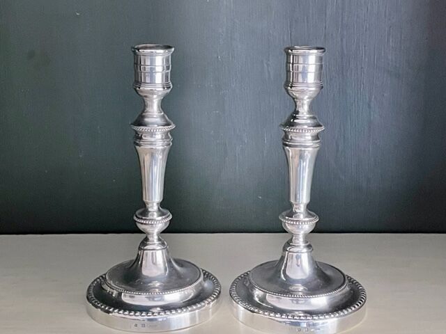 Pair of Christofle silver metal candle holders.