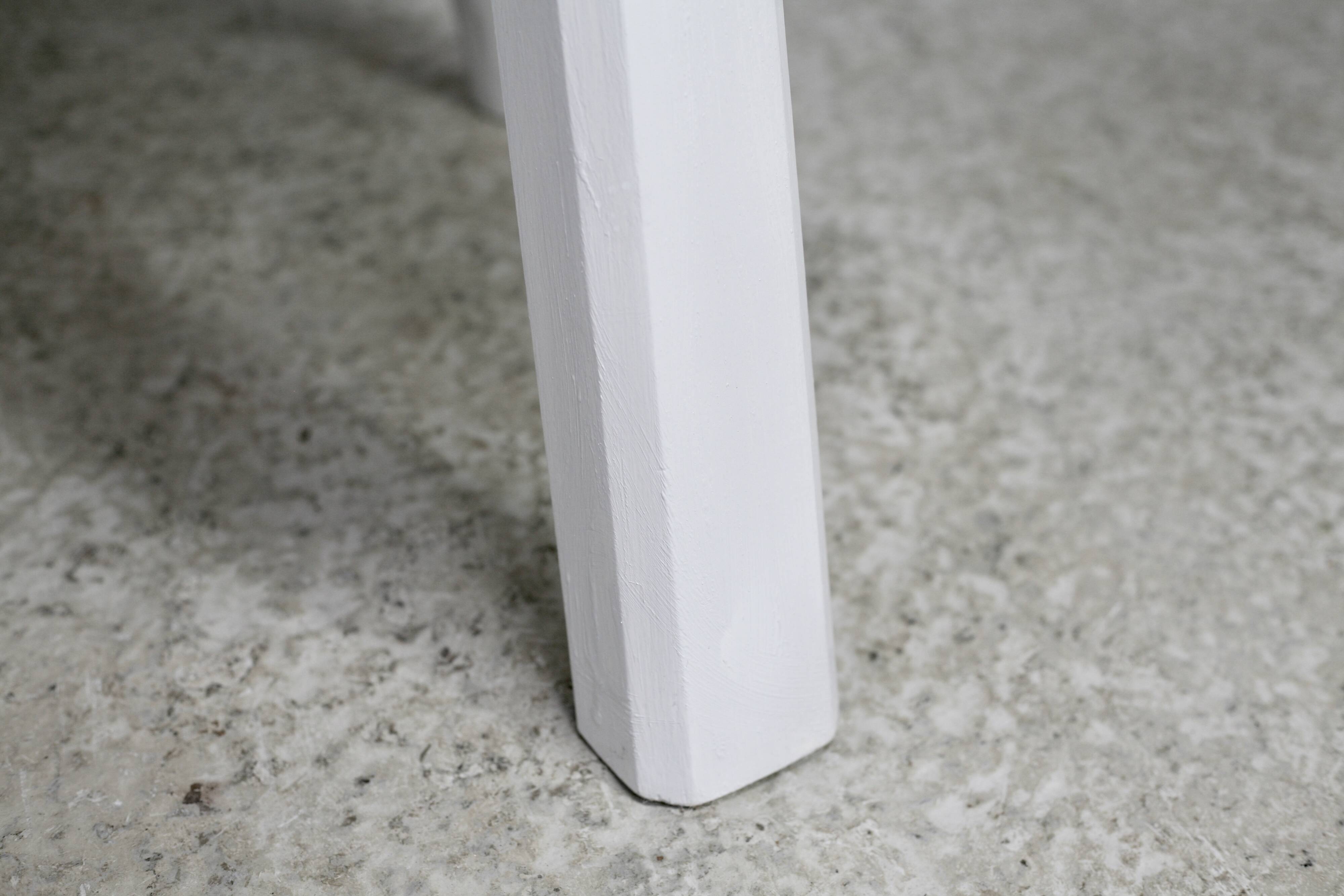 Pair of tripod chairs, gouged seats. Brutalist, circa 1960. Painted wood.