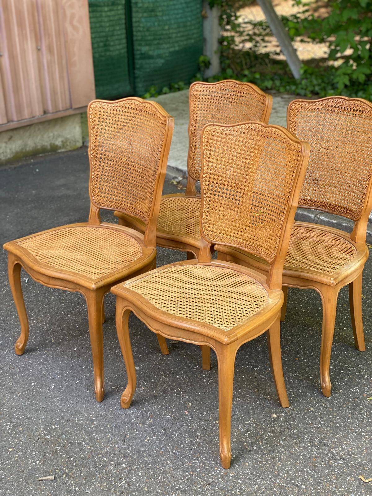4 Louis XV dining chairs in light solid oak with caning.