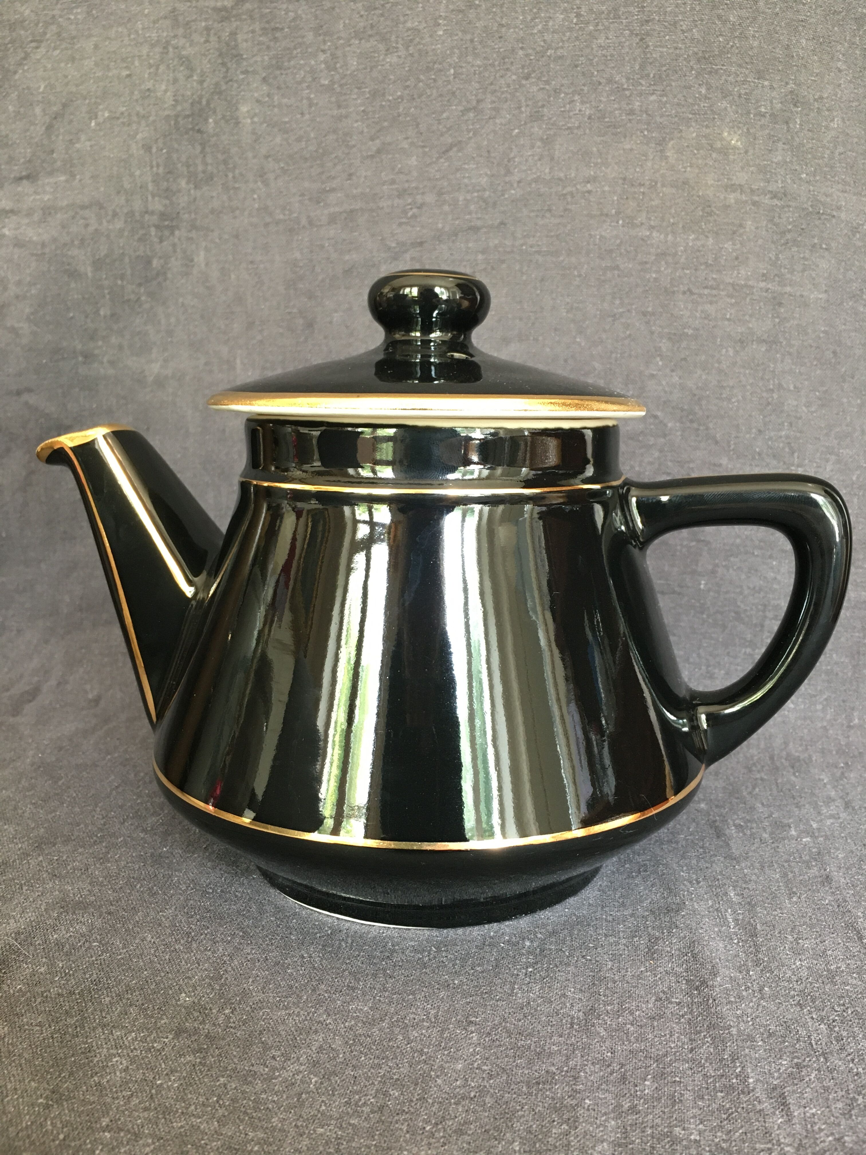 Black and gold ceramic coffee maker