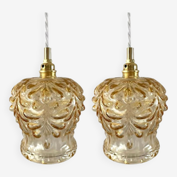 Set of two suspensions in gilded chiseled glass