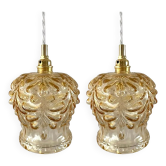 Set of two suspensions in gilded chiseled glass