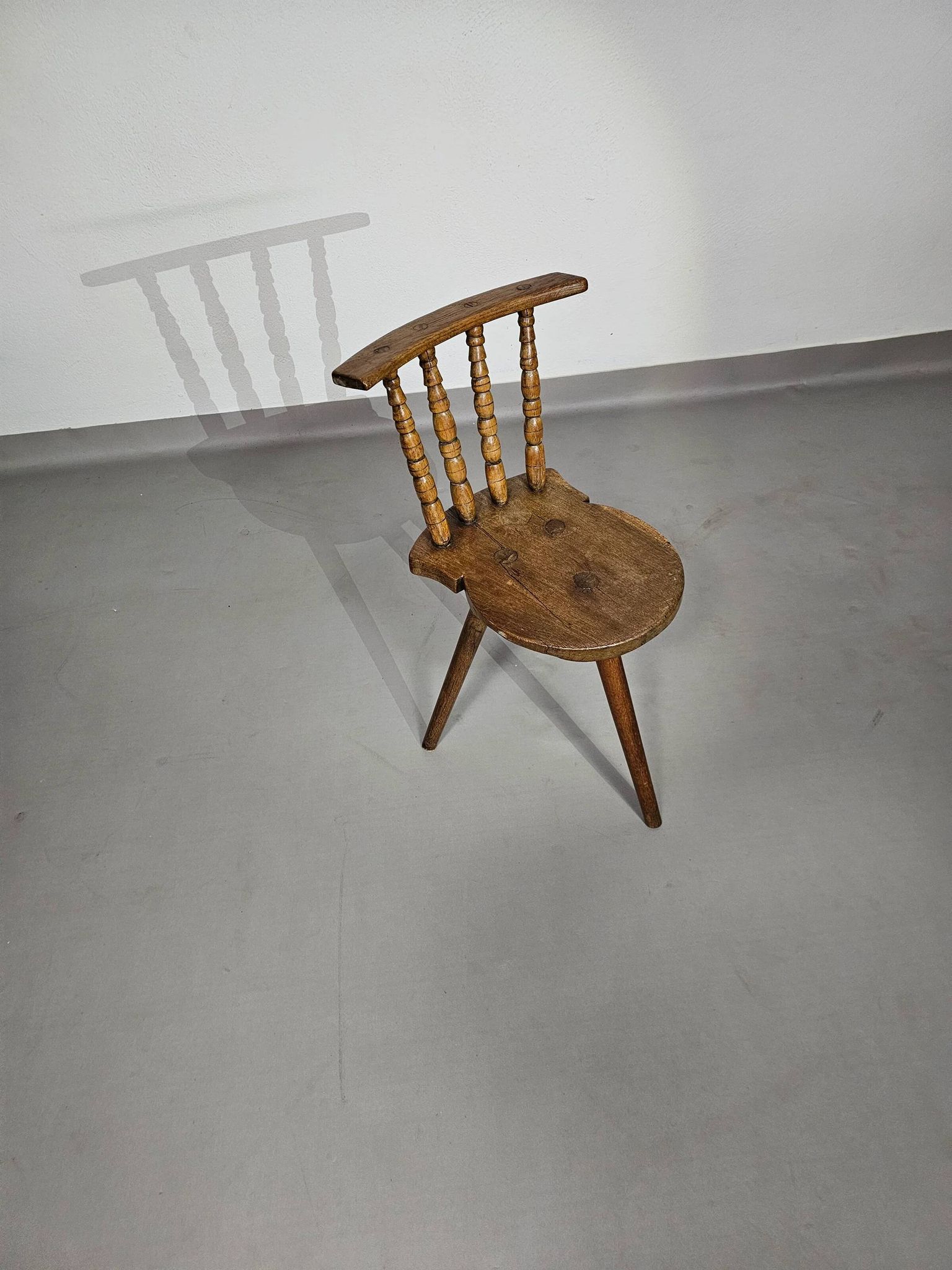 Old farmers tripod chair for decorative use