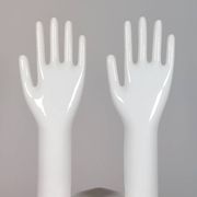 Pair of authentic vintage jewellery displays in industrial porcelain representing hands.