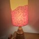 Vintage lamp with a carved wooden base from the 1970s.