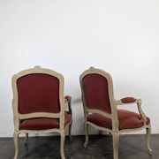 Pair of red cabriolet armchairs in Louis XV style