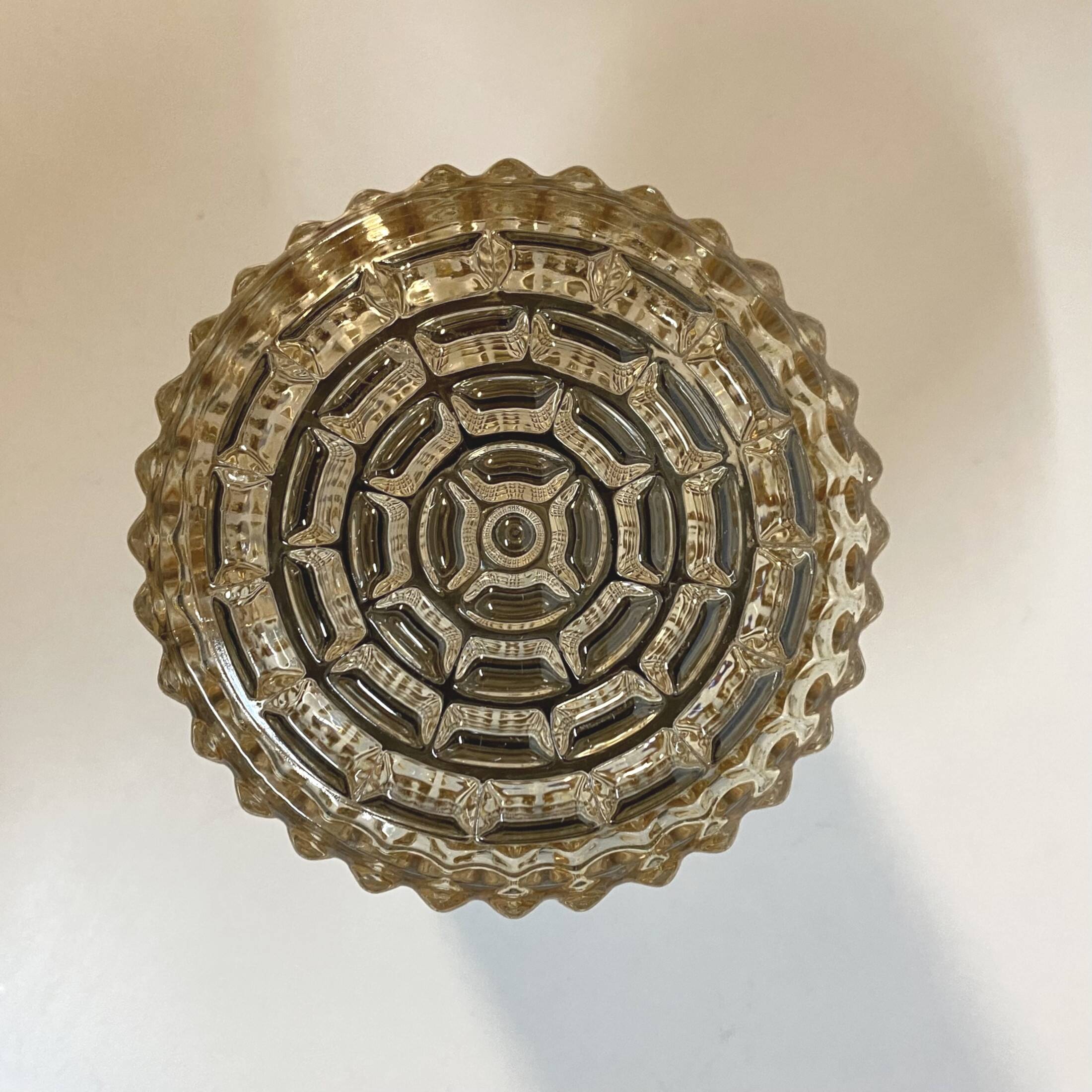 Old wall light in amber glass and plastic fixing base 1970