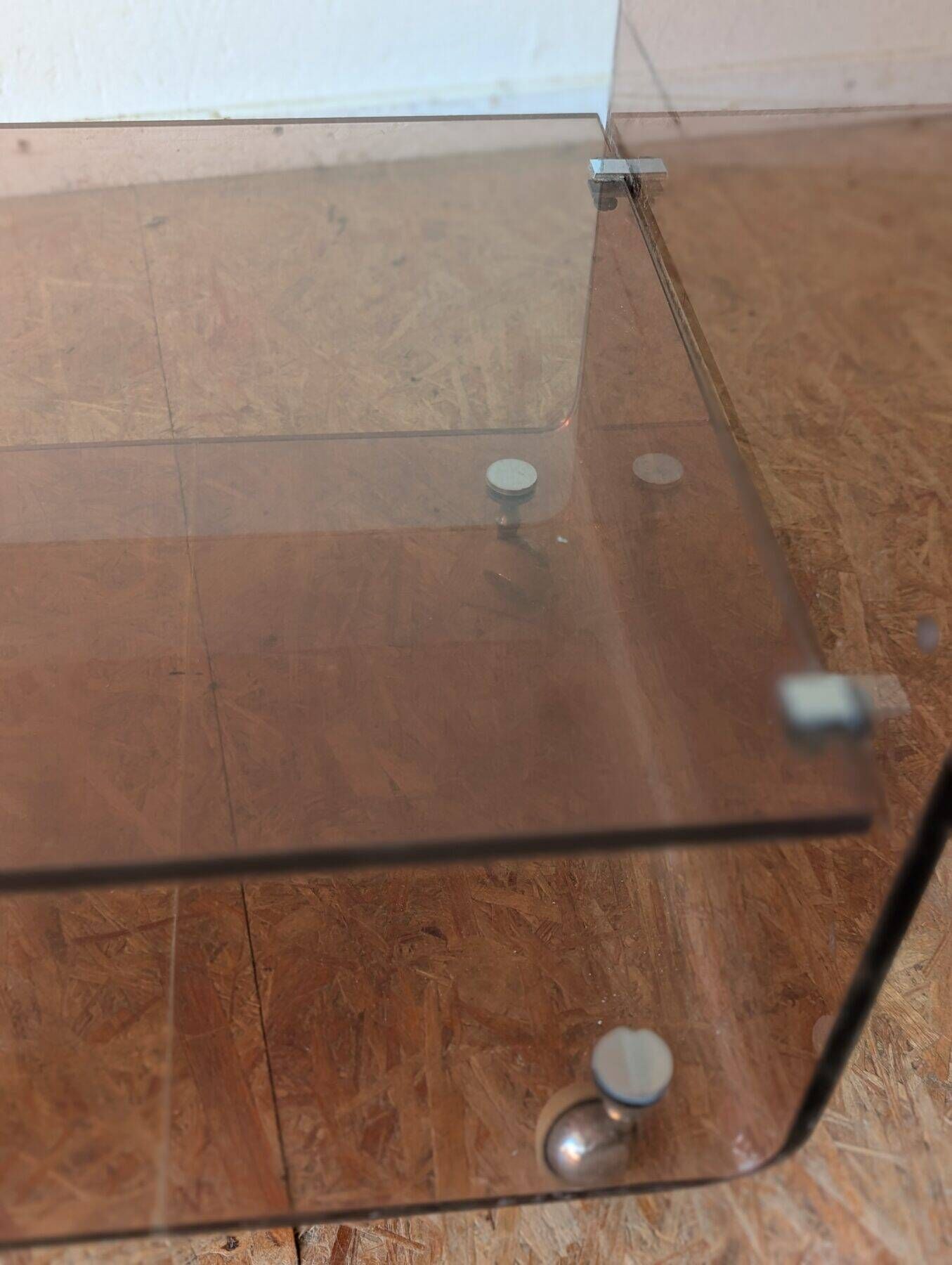 Pair of vintage smoked plexiglass bedside tables or accent furniture.