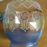 Enamelled glass ball vase decorated with beads and garlands