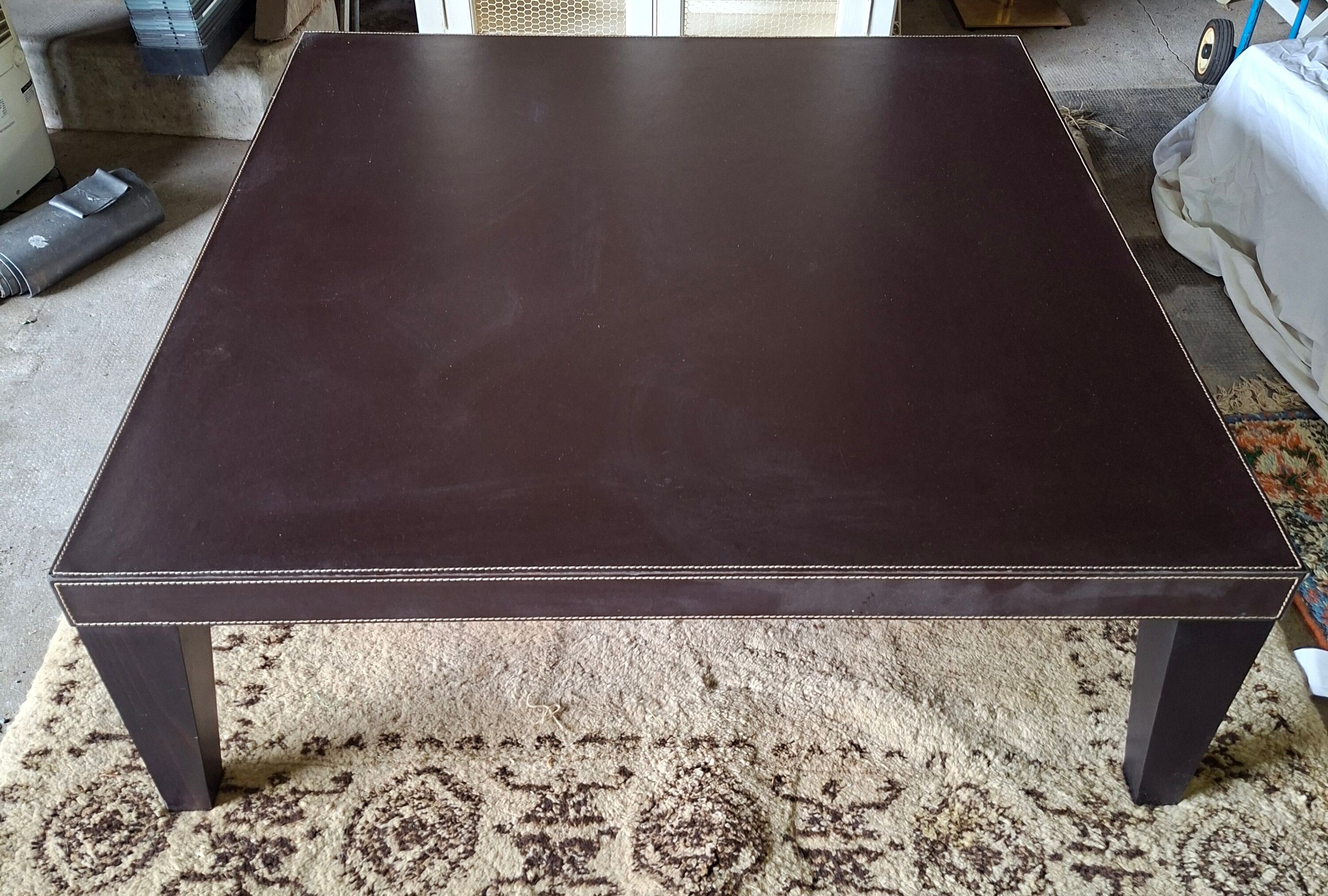 Leather-covered coffee table Roche Bobois