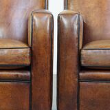 Set of 2 stylish yet comfortable armchairs made of sheepskin leather with a sleek design