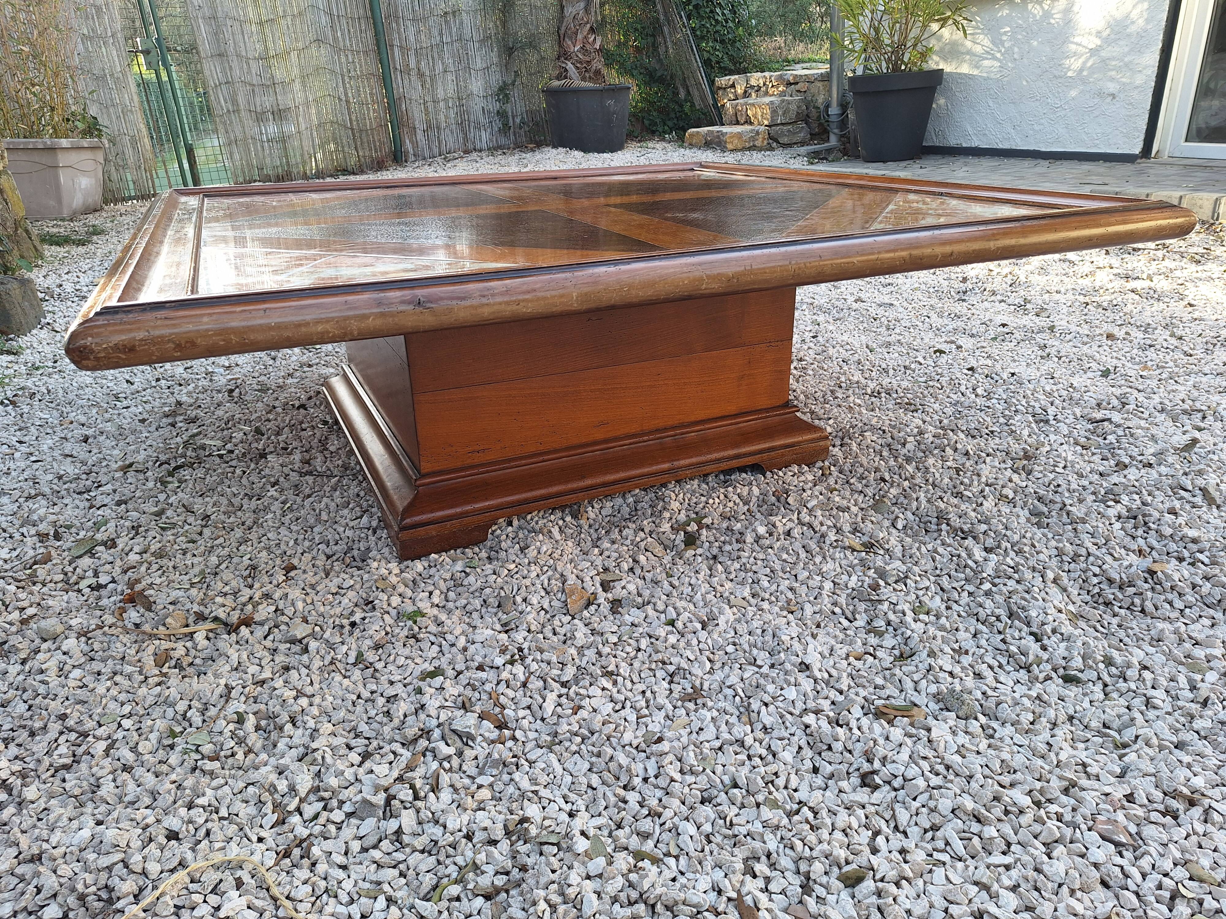 Coffee table with wood marquetry and marble inlays.