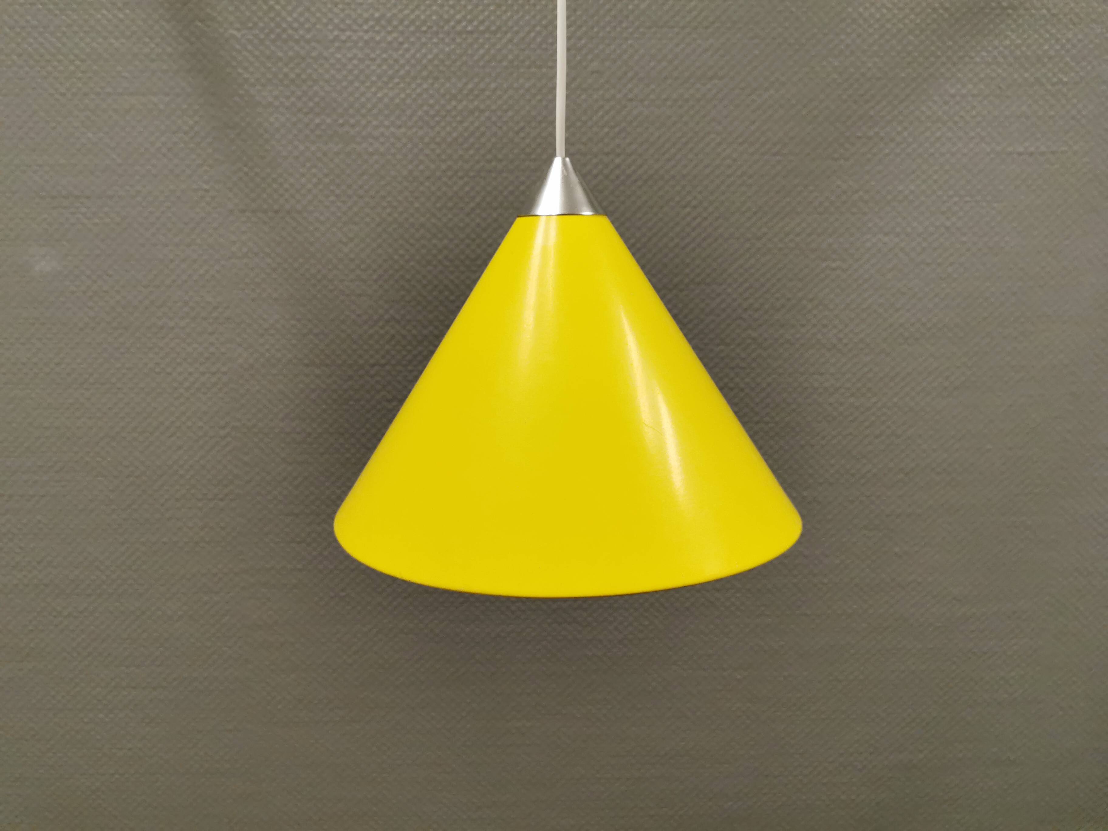 Small cone-shaped lamp in beautiful yellow lacquer finish.