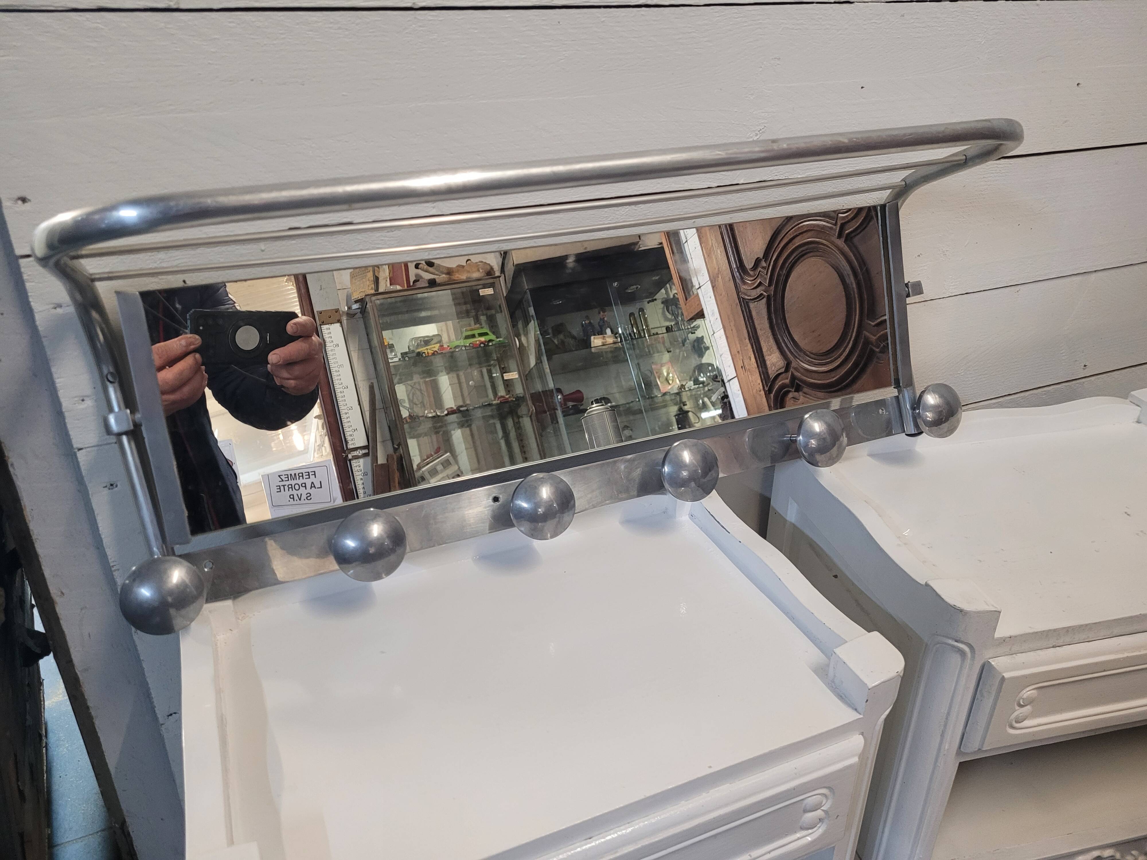 Aluminum wall coat rack with pivoting mirror from the 60s